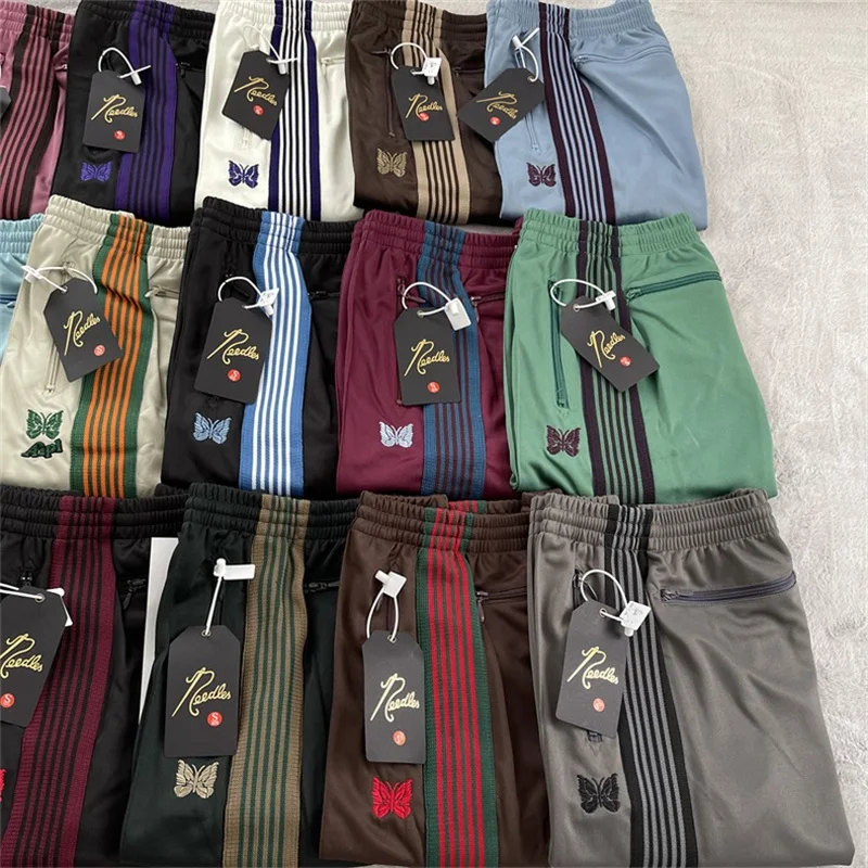 25ss Butterfly Embroidery AWGE Pants Men Women Best Quality Multicolor Ribbon Striped Sweatpants White Zipper Pocket Trousers
25ss Butterfly Embroidery AWGE Pants Men Women Best Quality Multicolor Ribbon Striped Sweatpants White Zipper Pocket Trousers