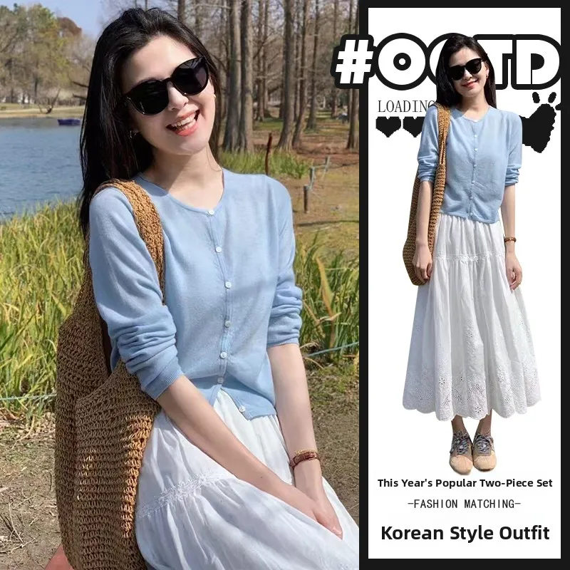 Spring Summer 2026 New Korean Style Blue Knitted Open Cardigan Long Sleeve Top And High Waist Cake Skirt Two Piece Set
Spring Summer 2026 New Korean Style Blue Knitted Open Cardigan Long Sleeve Top And High Waist Cake Skirt Two Piece Set