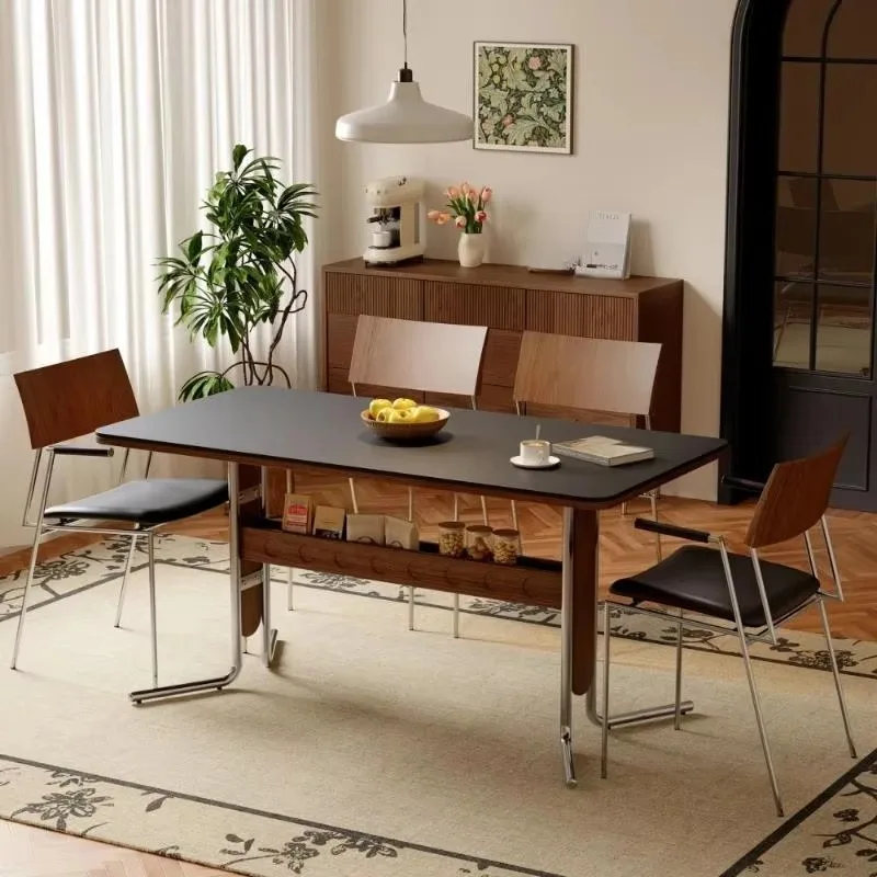 Mid-century modern rectangular dining table with solid wood legs and metal frame
Mid-century modern rectangular dining table with solid wood legs and metal frame