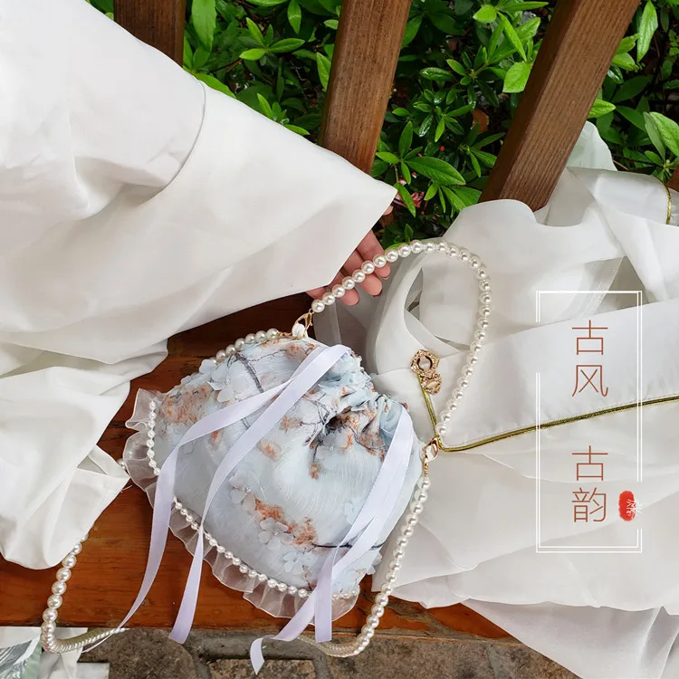 New Chinese Style Pearl Hanfu Bag with Three-dimensional Woven Flowers and Ancient Tassel Small Round Bag, hand-held bag
New Chinese Style Pearl Hanfu Bag with Three-dimensional Woven Flowers and Ancient Tassel Small Round Bag, hand-held bag