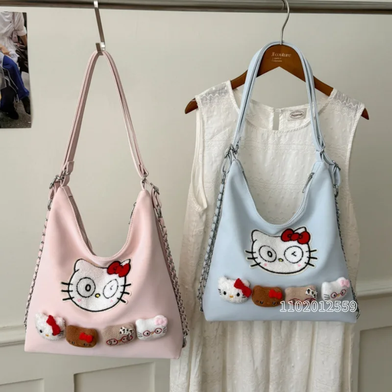 Новая женская сумка через плечо Hello Kitty с вышивкой, модная женская сумка с мультяшным принтом, женская сумка из искусственной кожи большой вместимости, высокое качество
Новая женская сумка через плечо Hello Kitty с вышивкой, модная женская сумка с мультяшным принтом, женская сумка из искусственной кожи большой вместимости, высокое качество