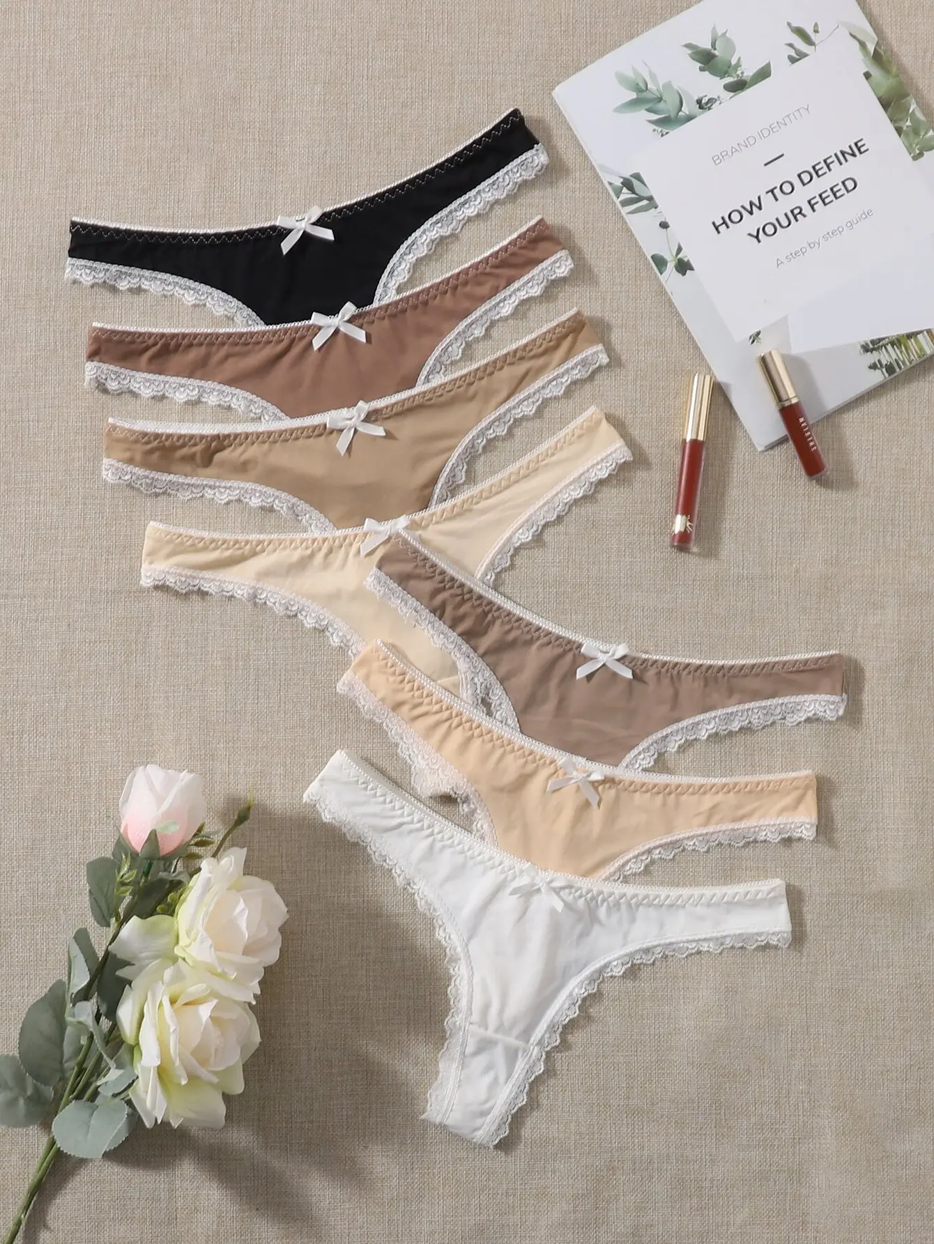 7-Pack Women's Lace Trim Thong Panties with Bow Detail in Neutral Tones
7-Pack Women's Lace Trim Thong Panties with Bow Detail in Neutral Tones