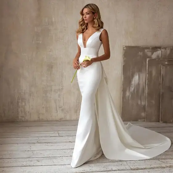 White Cap Sleeve Deep V-Neck Wedding Dresses Sheath Floor-Length Detachable Train Satin Sexy Open Back Zipper Bow Bridal Gowns
White Cap Sleeve Deep V-Neck Wedding Dresses Sheath Floor-Length Detachable Train Satin Sexy Open Back Zipper Bow Bridal Gowns