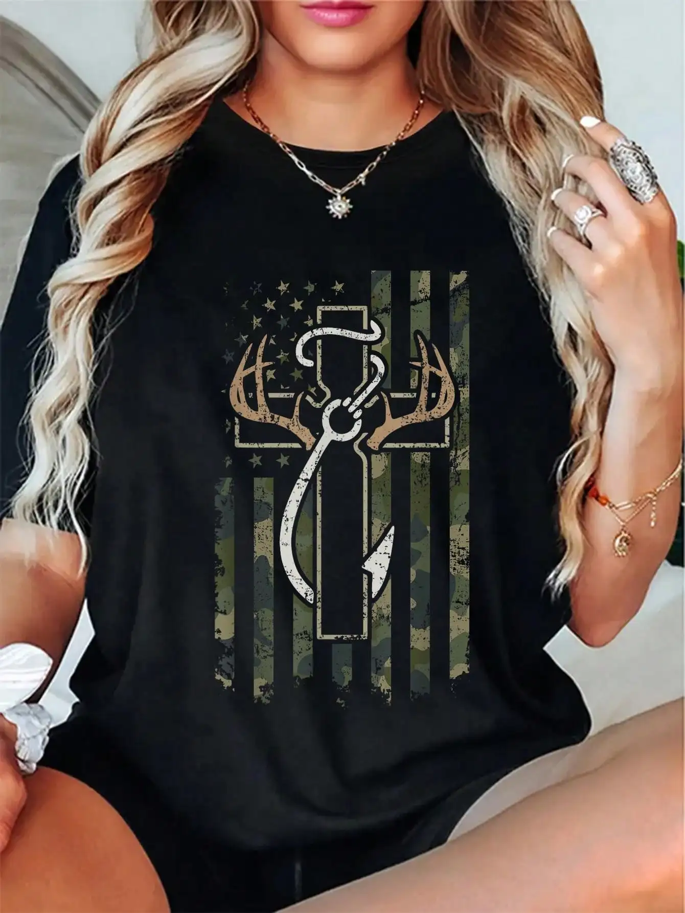 Black Loose Fit T-Shirt with Camo Flag Graphic and Antler Cross Design
Black Loose Fit T-Shirt with Camo Flag Graphic and Antler Cross Design