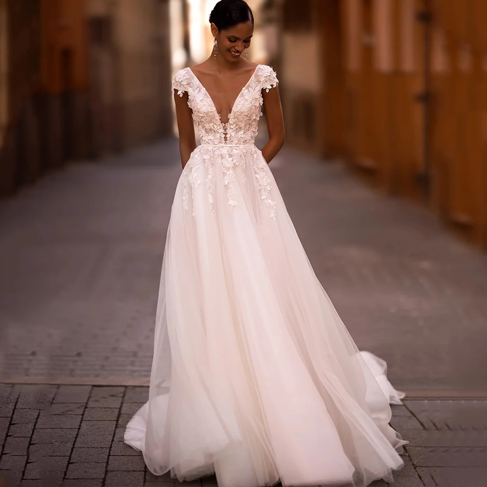 Exquisite Cap Sleeve Applique Flower Wedding Dress Deep V-Neck with Belt A-Line Tulle Open Back Zipper Gowns for Marriage Bride 
Exquisite Cap Sleeve Applique Flower Wedding Dress Deep V-Neck with Belt A-Line Tulle Open Back Zipper Gowns for Marriage Bride