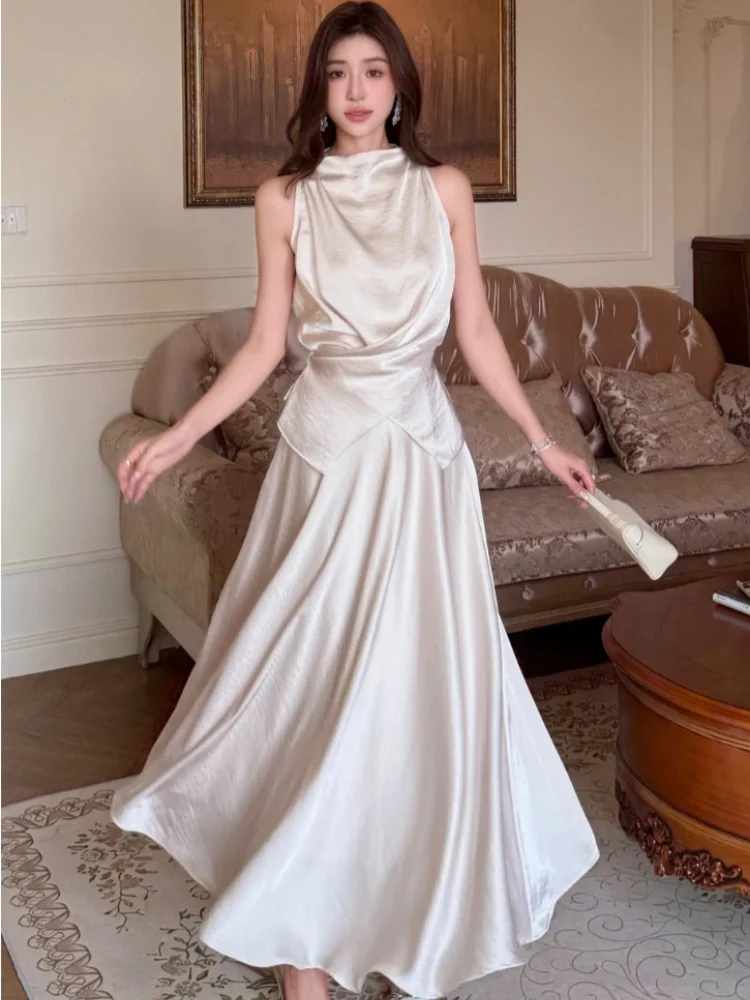 2025 New Summer Niche Design Satin Sleeveless Top Two-Piece Set High-End Slimming Fashion Solid Long Skirt 2 Piece Outfits
2025 New Summer Niche Design Satin Sleeveless Top Two-Piece Set High-End Slimming Fashion Solid Long Skirt 2 Piece Outfits