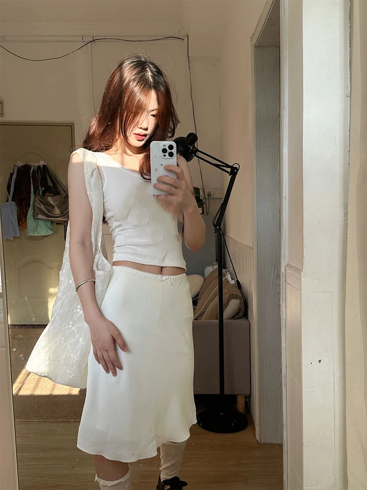 Юбка с кружевной отделкой и низкой талией, женская летняя сексуальная маленькая белая юбка трапециевидной формы с бантом, облегающая юбка средней длины
Юбка с кружевной отделкой и низкой талией, женская летняя сексуальная маленькая белая юбка трапециевидной формы с бантом, облегающая юбка средней длины