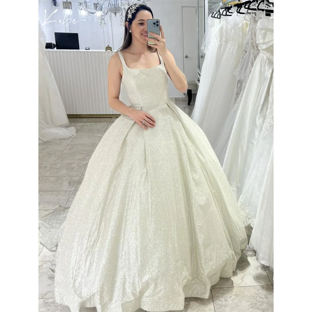 Kobe Spaghetti Strap Square Collar Wedding Dresses 2025 Shine Sequins Bridal Dresses Sleeveless Court Train Customized Ball Gown
Kobe Spaghetti Strap Square Collar Wedding Dresses 2025 Shine Sequins Bridal Dresses Sleeveless Court Train Customized Ball Gown
