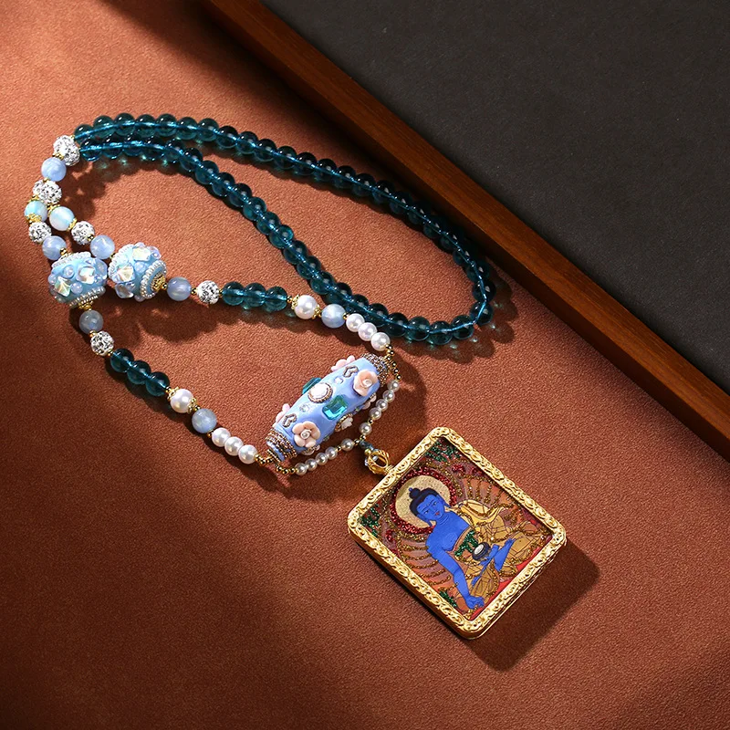 Tibetan Medicine Buddha Thangka , Semi-Hand-Painted Gold-Embellished Gahu Box Pendant Necklace, Vintage and Vers
Tibetan Medicine Buddha Thangka , Semi-Hand-Painted Gold-Embellished Gahu Box Pendant Necklace, Vintage and Vers