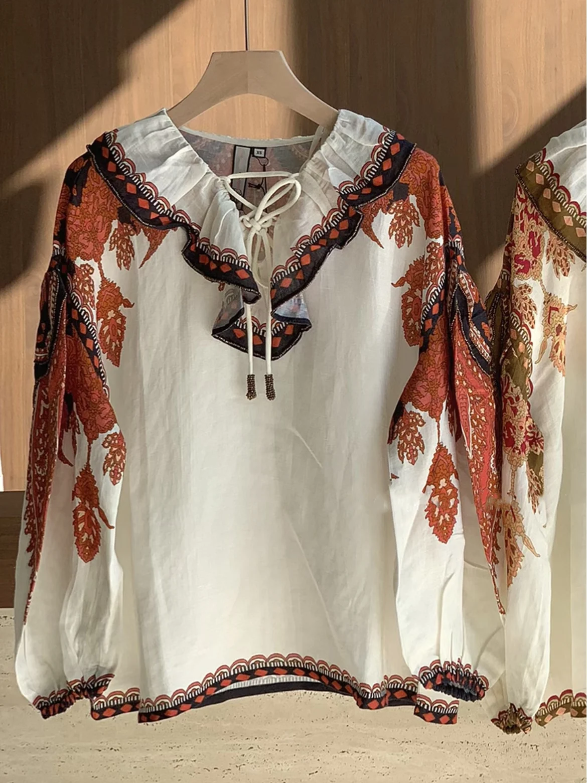 Heidd Ethnic Print Beaded Loose Long Sleeve Shirt Women's Spring 2026 V-neck Gored Hemline Fashion Ladies Shirt
Heidd Ethnic Print Beaded Loose Long Sleeve Shirt Women's Spring 2026 V-neck Gored Hemline Fashion Ladies Shirt