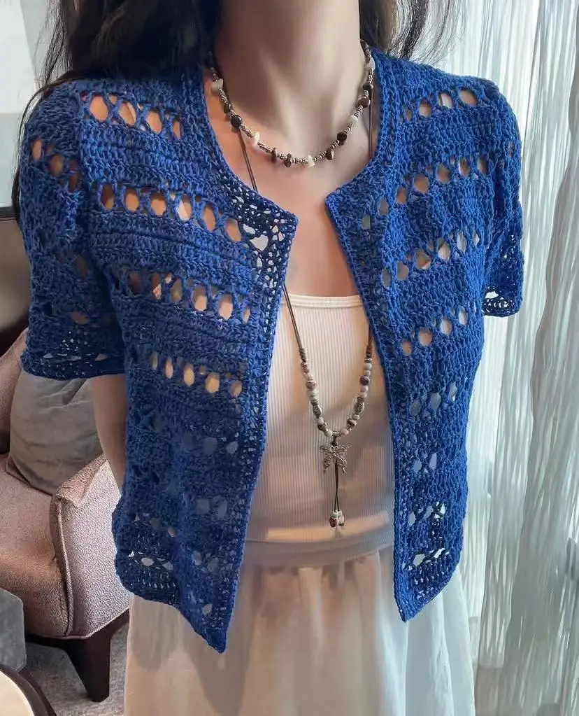 Handmade crochet hollowed out cardigan for women, featuring a niche blue design, paired with a sun protection cover
Handmade crochet hollowed out cardigan for women, featuring a niche blue design, paired with a sun protection cover