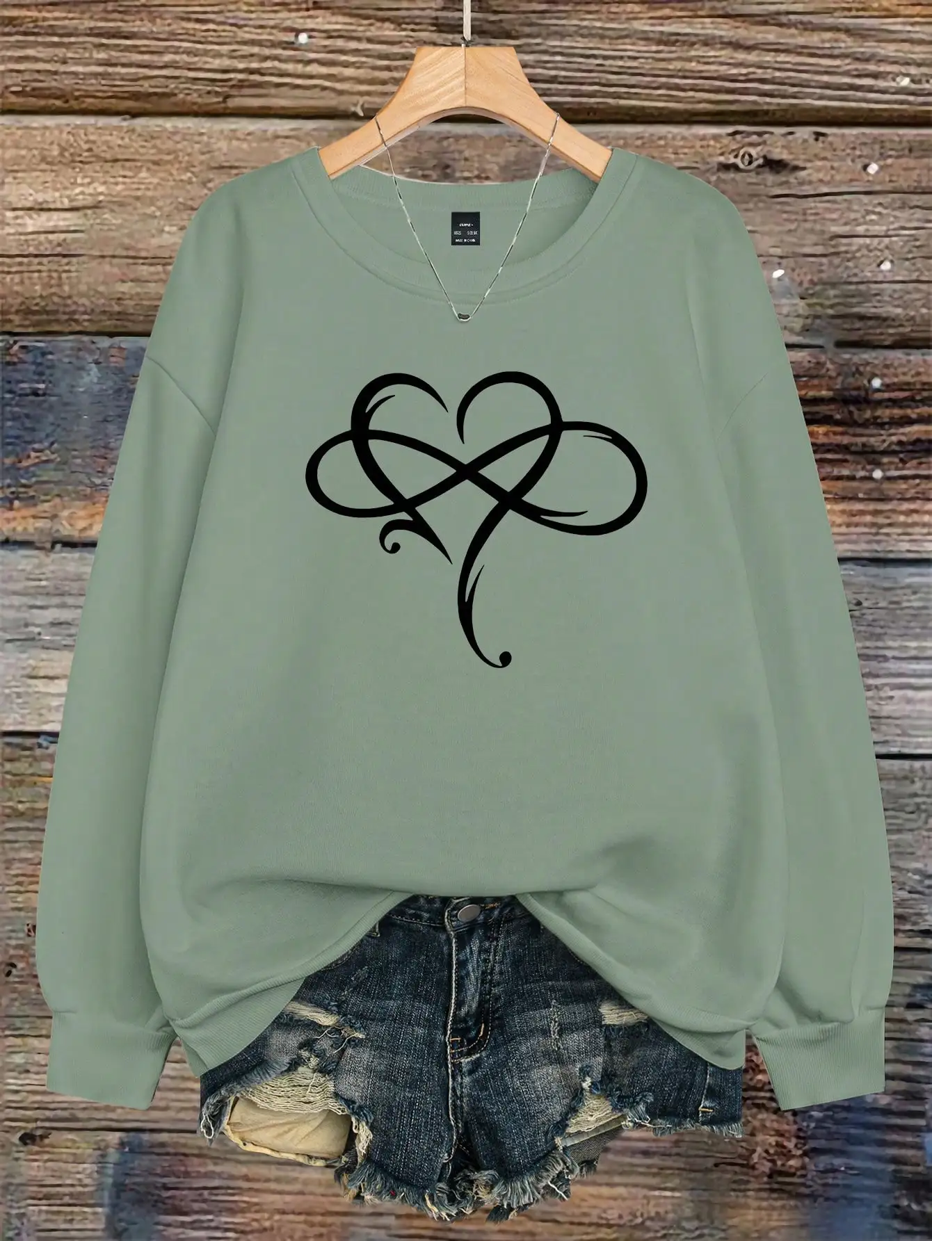 Оливково-зеленый свитшот с длинными рукавами и абстрактным рисунком в виде сердца, свободного кроя для повседневной осенней носки
Оливково-зеленый свитшот с длинными рукавами и абстрактным рисунком в виде сердца, свободного кроя для повседневной осенней носки