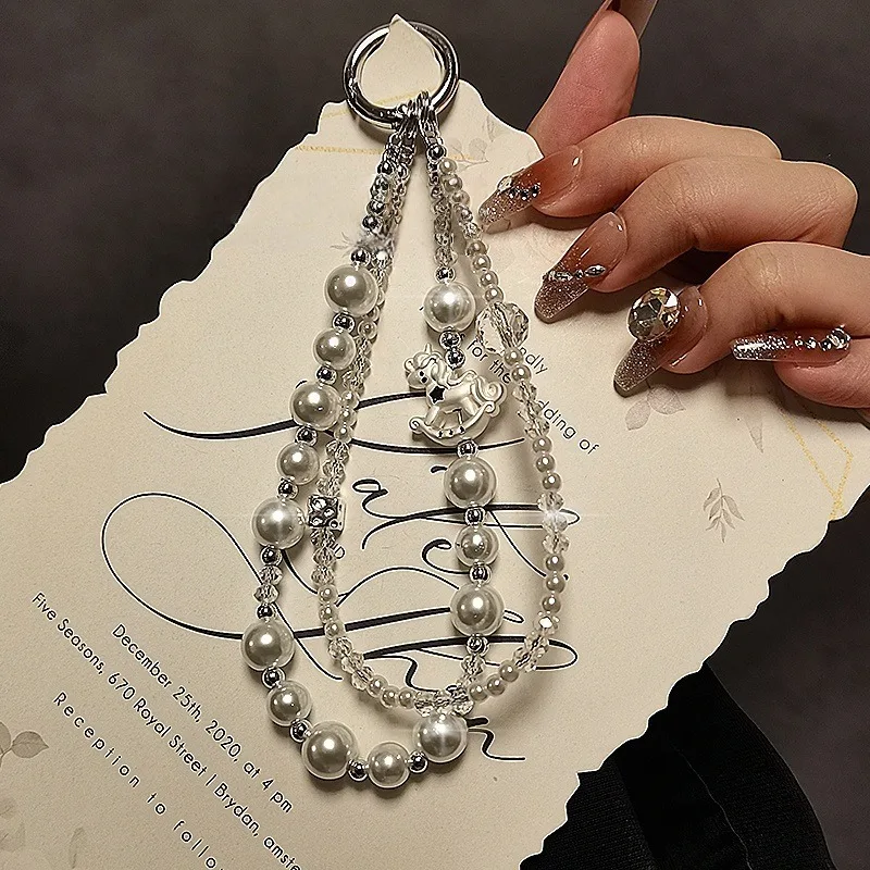 Fashion Pearl Phone Chain Creative Carousel Beaded Crystal Double Chain Phone Rope Handheld Chain Keychain Bag Pendant
Fashion Pearl Phone Chain Creative Carousel Beaded Crystal Double Chain Phone Rope Handheld Chain Keychain Bag Pendant