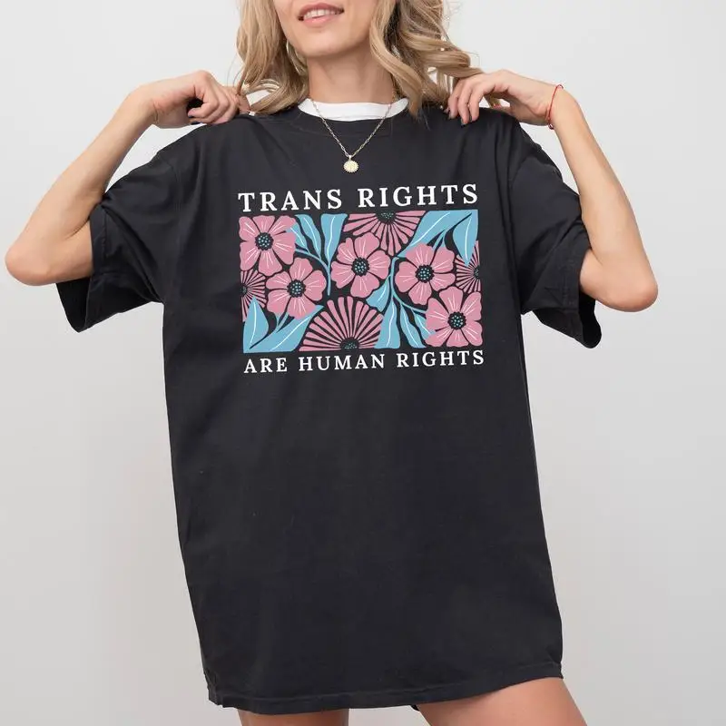 LGBTQ+ Ally T-shirt "Trans Rights Are Human Rights" Slogan, Floral Graphic Tee, Human Rights Awareness Top
LGBTQ+ Ally T-shirt "Trans Rights Are Human Rights" Slogan, Floral Graphic Tee, Human Rights Awareness Top