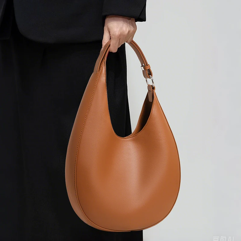 AIDRANI Genuine leather cowhide design sense irregular crescent moon women's single shoulder armpit cross-body semi-circle bag
AIDRANI Genuine leather cowhide design sense irregular crescent moon women's single shoulder armpit cross-body semi-circle bag