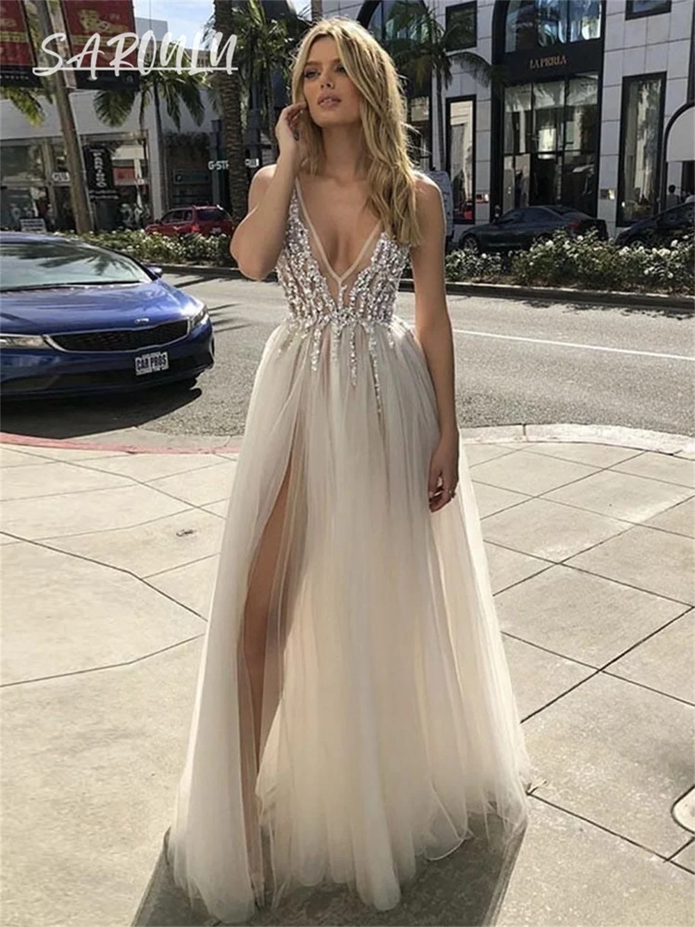 Chic Tulle Bride Dress Illusion Side Slit Customized Beach Bridal Gown Plus Size Sequins Backless Ivory Bride Dresses
Chic Tulle Bride Dress Illusion Side Slit Customized Beach Bridal Gown Plus Size Sequins Backless Ivory Bride Dresses