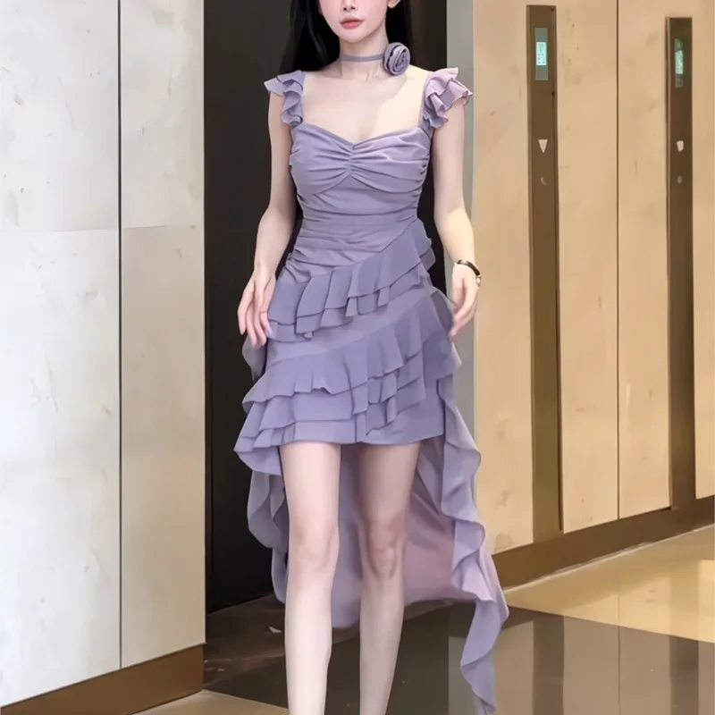 An irregularly ruffled sleeveless halter dress with a purple cinched waist and drawstring
An irregularly ruffled sleeveless halter dress with a purple cinched waist and drawstring