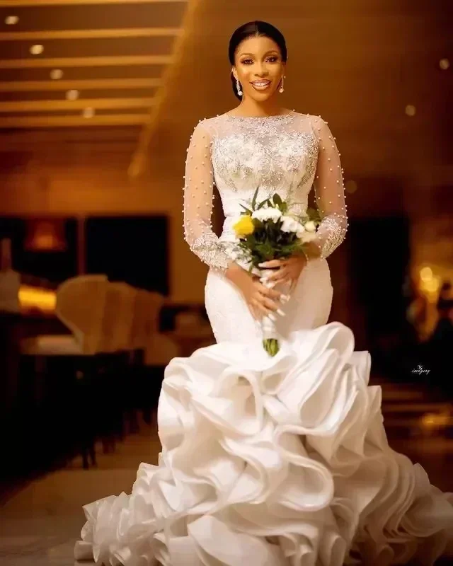 Customized Arabic Aso Ebi Lace Luxurious Mermaid Wedding Dress Sheer Crystals Pearls Beaded Tiers Long Sleeves Bridal Gowns Dres
Customized Arabic Aso Ebi Lace Luxurious Mermaid Wedding Dress Sheer Crystals Pearls Beaded Tiers Long Sleeves Bridal Gowns Dres