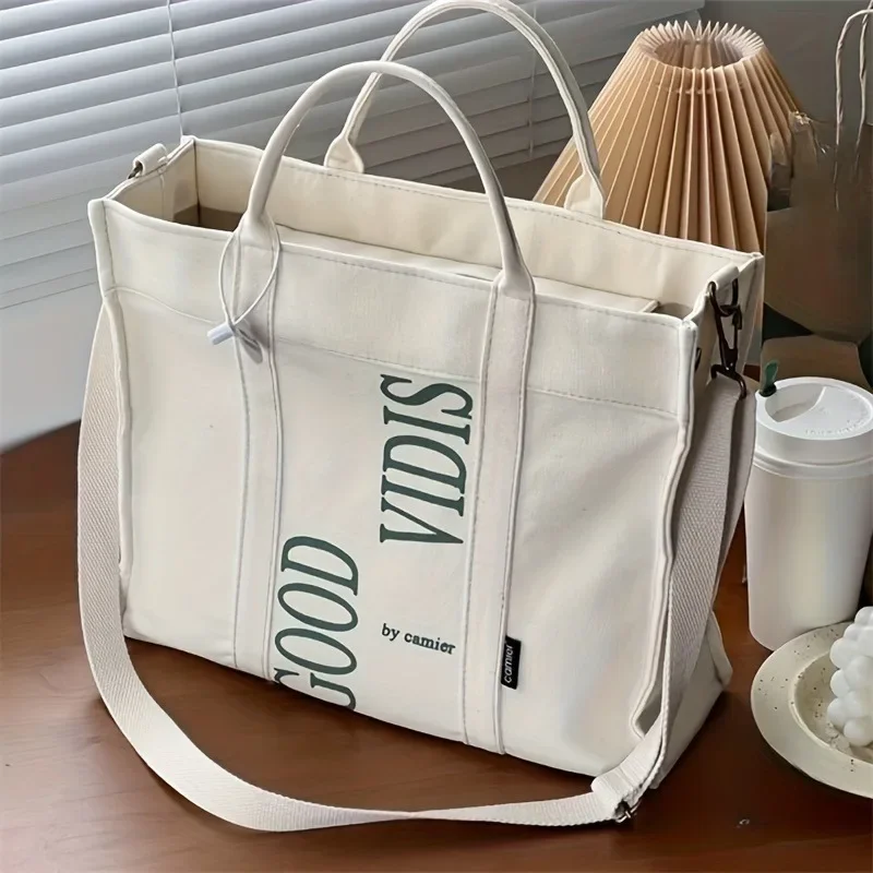College Style Simple and Versatile Large Capacity Tote Bag, Letter Printed Canvas Crossbody Bags, Suitable for Commuting
College Style Simple and Versatile Large Capacity Tote Bag, Letter Printed Canvas Crossbody Bags, Suitable for Commuting