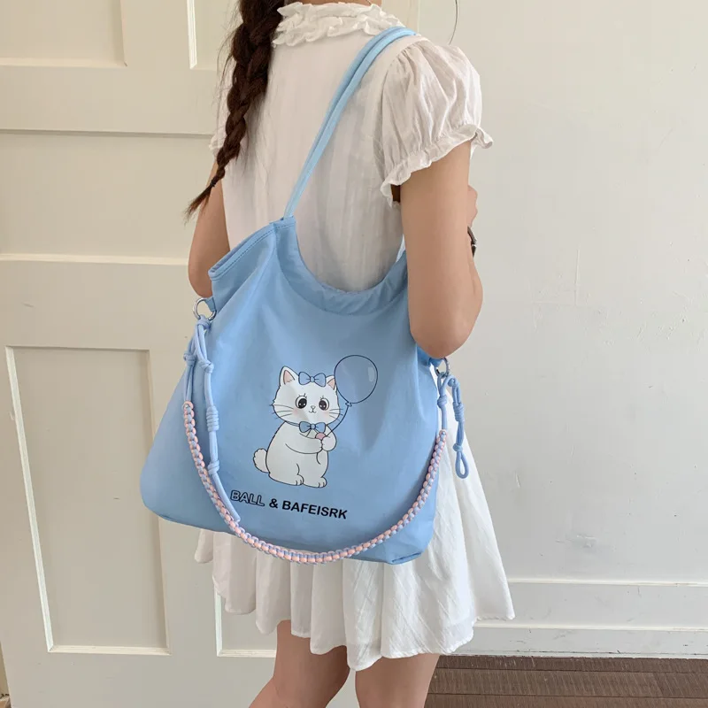 Japanese Cartoon Cat Canvas Shoulder Bag Women's 2026 New Summer New Large-capacity Girl Crossbody Commuter Light Tote Bag
Japanese Cartoon Cat Canvas Shoulder Bag Women's 2026 New Summer New Large-capacity Girl Crossbody Commuter Light Tote Bag