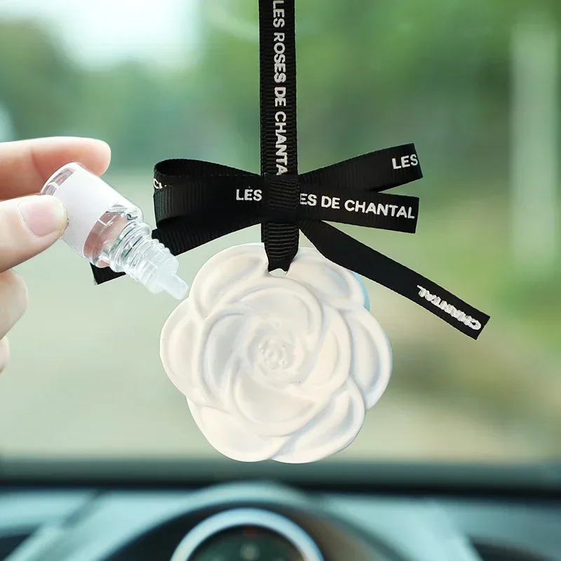 Car Camellia Scented Diffuser Stone Rearview Mirror Pendant Fashion Auto Interior Fragrance Accessory for Fresh Air
Car Camellia Scented Diffuser Stone Rearview Mirror Pendant Fashion Auto Interior Fragrance Accessory for Fresh Air