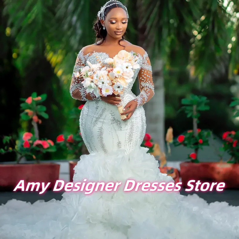 Customized Sparkle Crystals Rhinestones Garden Mermaid Wedding Dress African Long Sleeves Multi-Layered Ruffles Bridal Gowns
Customized Sparkle Crystals Rhinestones Garden Mermaid Wedding Dress African Long Sleeves Multi-Layered Ruffles Bridal Gowns