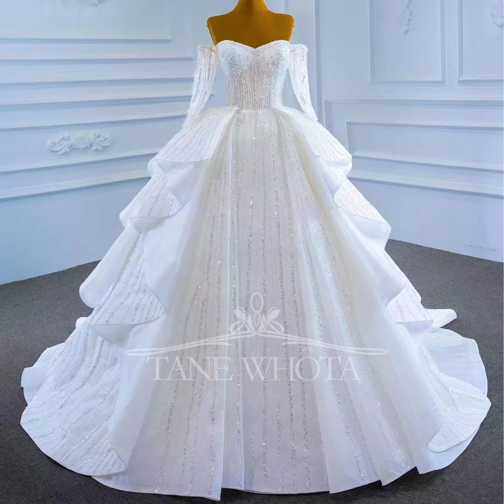 Роскошное многоуровневое свадебное платье с блестками, сексуальное свадебное платье с длинными рукавами и шнуровкой сзади, настраиваемое свадебное платье
Роскошное многоуровневое свадебное платье с блестками, сексуальное свадебное платье с длинными рукавами и шнуровкой сзади, настраиваемое свадебное платье