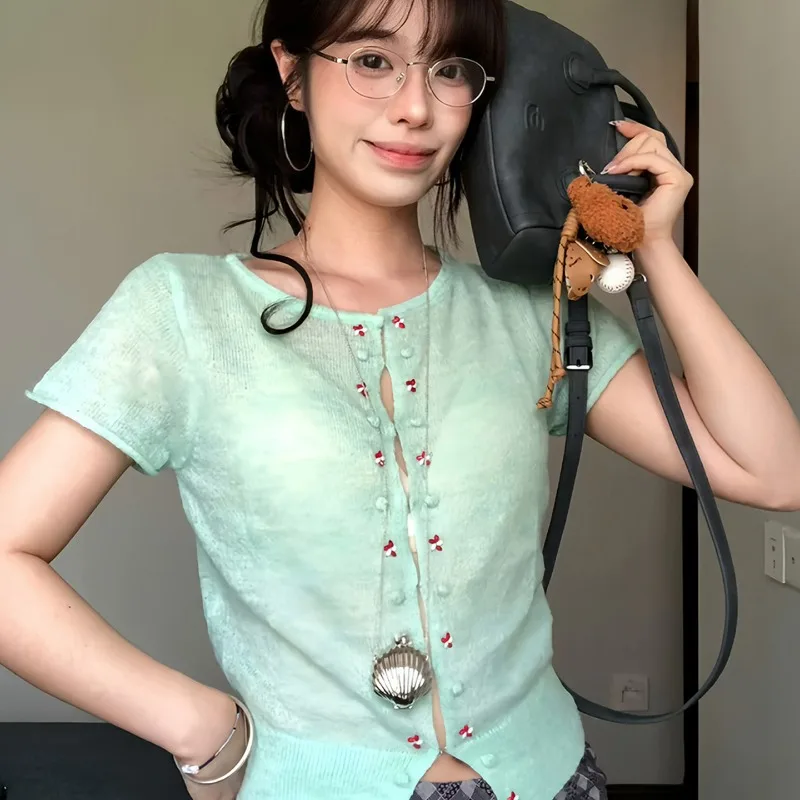 The Mint Green Short-sleeved Knitted Cardigan for Women's Summer New hollow out Tops That Is Slimming Breathable Trendy Design
The Mint Green Short-sleeved Knitted Cardigan for Women's Summer New hollow out Tops That Is Slimming Breathable Trendy Design