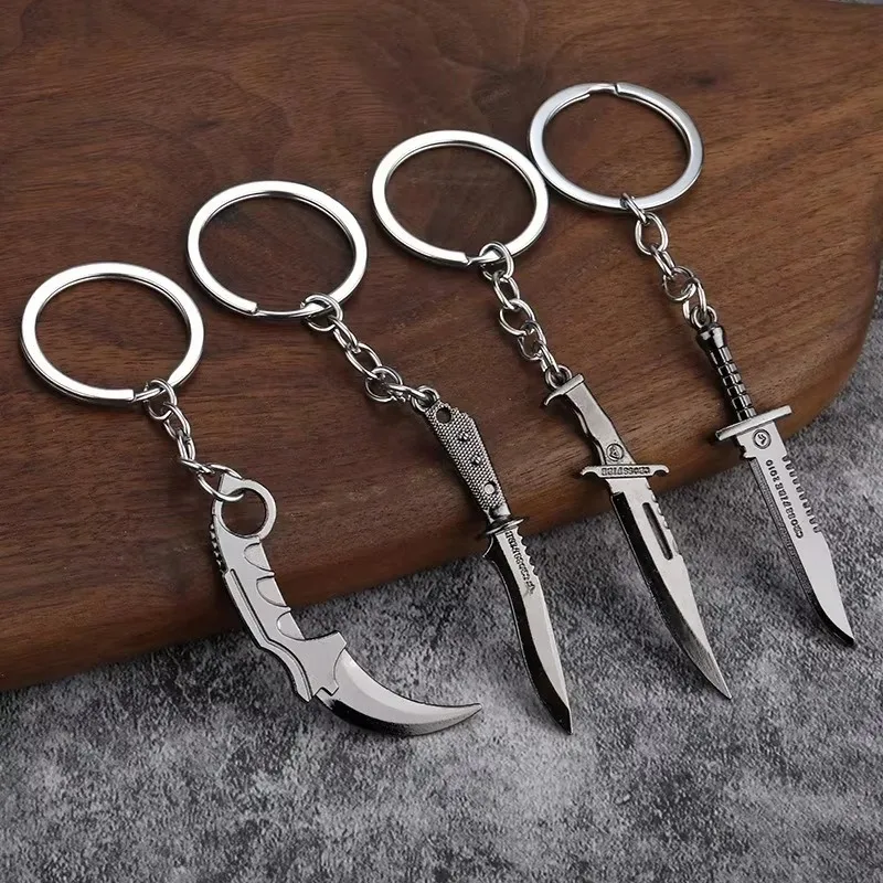 Мужские автомобильные украшения Tiy, подарок для любителей милитари, металлический коготь, нож, брелок для ключей, пистолет, черный цвет, тактический кинжал, брелок для ключей
Мужские автомобильные украшения Tiy, подарок для любителей милитари, металлический коготь, нож, брелок для ключей, пистолет, черный цвет, тактический кинжал, брелок для ключей
