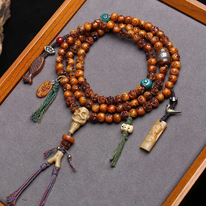 108-bead Buddhist rosary carved from yak bone by Tibetan artisans, featuring the “A Dai” design
108-bead Buddhist rosary carved from yak bone by Tibetan artisans, featuring the “A Dai” design