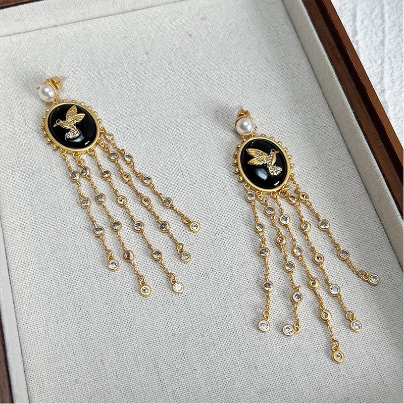 Vintage BLACK bird disc pearl elegant sparkling tassel creative long earrings for women
Vintage BLACK bird disc pearl elegant sparkling tassel creative long earrings for women