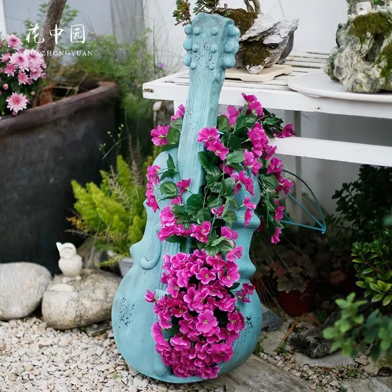 Outdoor garden decoration creative store door layout guitar flower pot retro old piano courtyard landscape ornament
Outdoor garden decoration creative store door layout guitar flower pot retro old piano courtyard landscape ornament