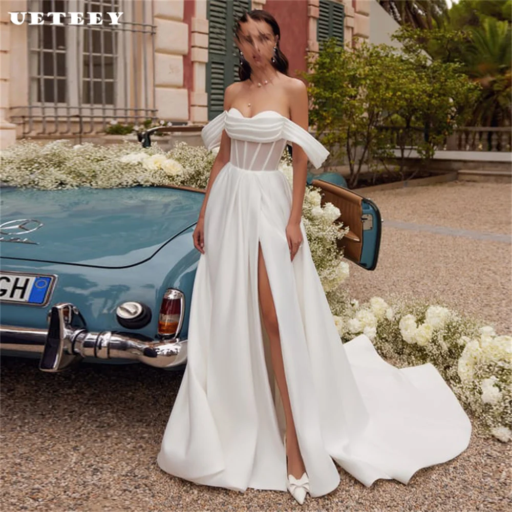UETEEY Customized Illusion Off Shoulder Satin A Line Wedding Dress Pleats Lace Up Back High Side Slit Court Train Bridal Gown
UETEEY Customized Illusion Off Shoulder Satin A Line Wedding Dress Pleats Lace Up Back High Side Slit Court Train Bridal Gown
