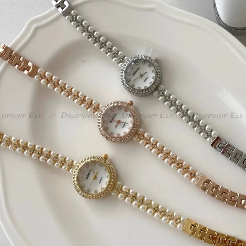 Роскошные женские часы с жемчужной цепочкой и маленьким циферблатом, высококачественные изысканные легкие роскошные женские часы с перламутровым циферблатом и высокой ракушкой Reloj Mujer
Роскошные женские часы с жемчужной цепочкой и маленьким циферблатом, высококачественные изысканные легкие роскошные женские часы с перламутровым циферблатом и высокой ракушкой Reloj Mujer