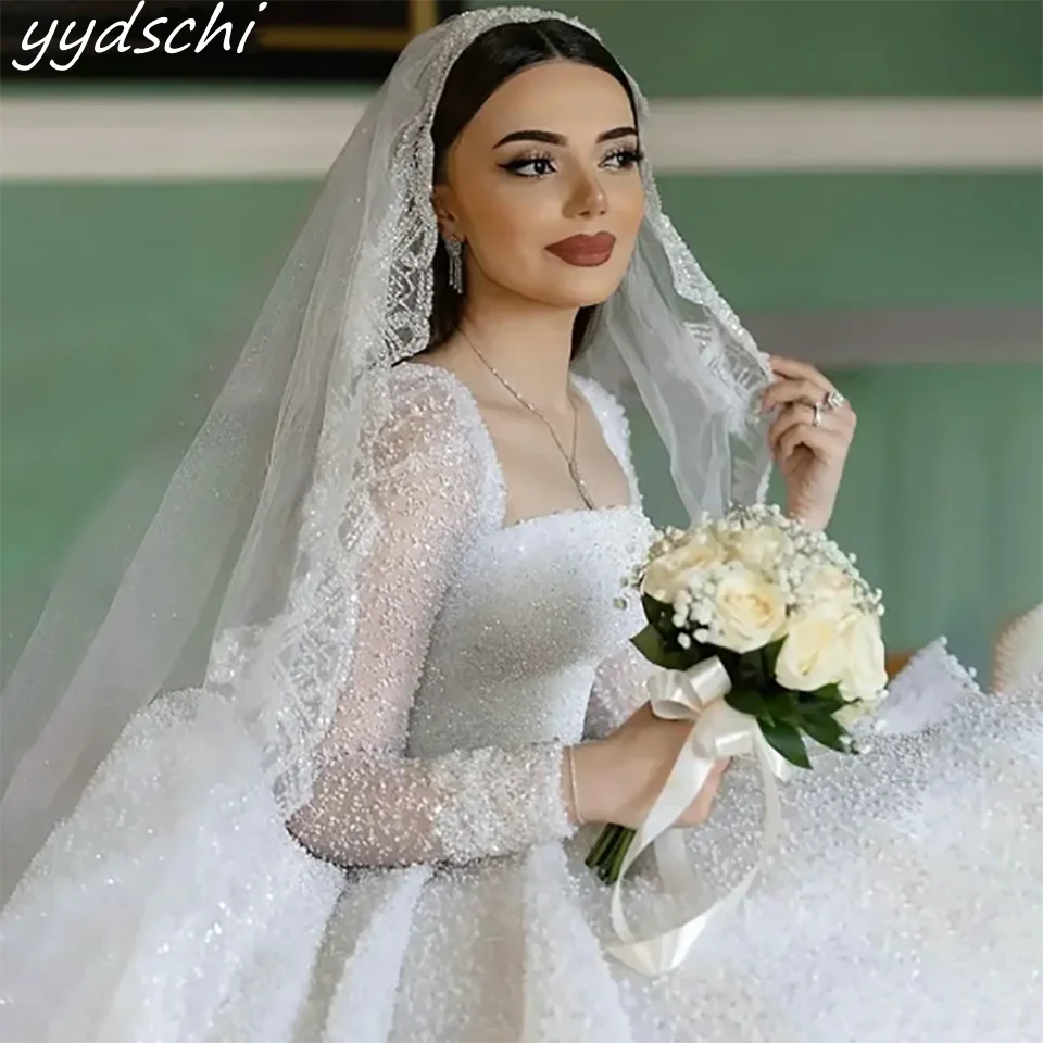 Customized Glitter Beaded Sequin Boat Neck Ball Gown Wedding Dresses 2024 Long Sleeves Court Train Tulle Bridal Gowns For Women
Customized Glitter Beaded Sequin Boat Neck Ball Gown Wedding Dresses 2024 Long Sleeves Court Train Tulle Bridal Gowns For Women