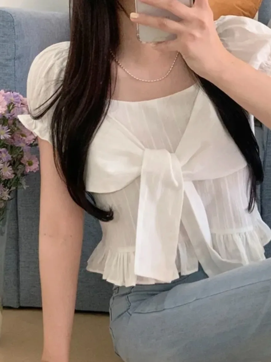 Корейская стильная женская летняя модная рубашка с коротким рукавом, оборками по низу, укороченная, с завязками и поясом, для омоложения образа
Корейская стильная женская летняя модная рубашка с коротким рукавом, оборками по низу, укороченная, с завязками и поясом, для омоложения образа