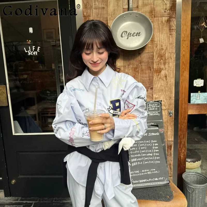 Japanese Fashion Women's Long-sleeved Shirt Letter Embroidered Graffiti Cute Top Spring and Summer New 2026 Ladies Loose Blouses
Japanese Fashion Women's Long-sleeved Shirt Letter Embroidered Graffiti Cute Top Spring and Summer New 2026 Ladies Loose Blouses