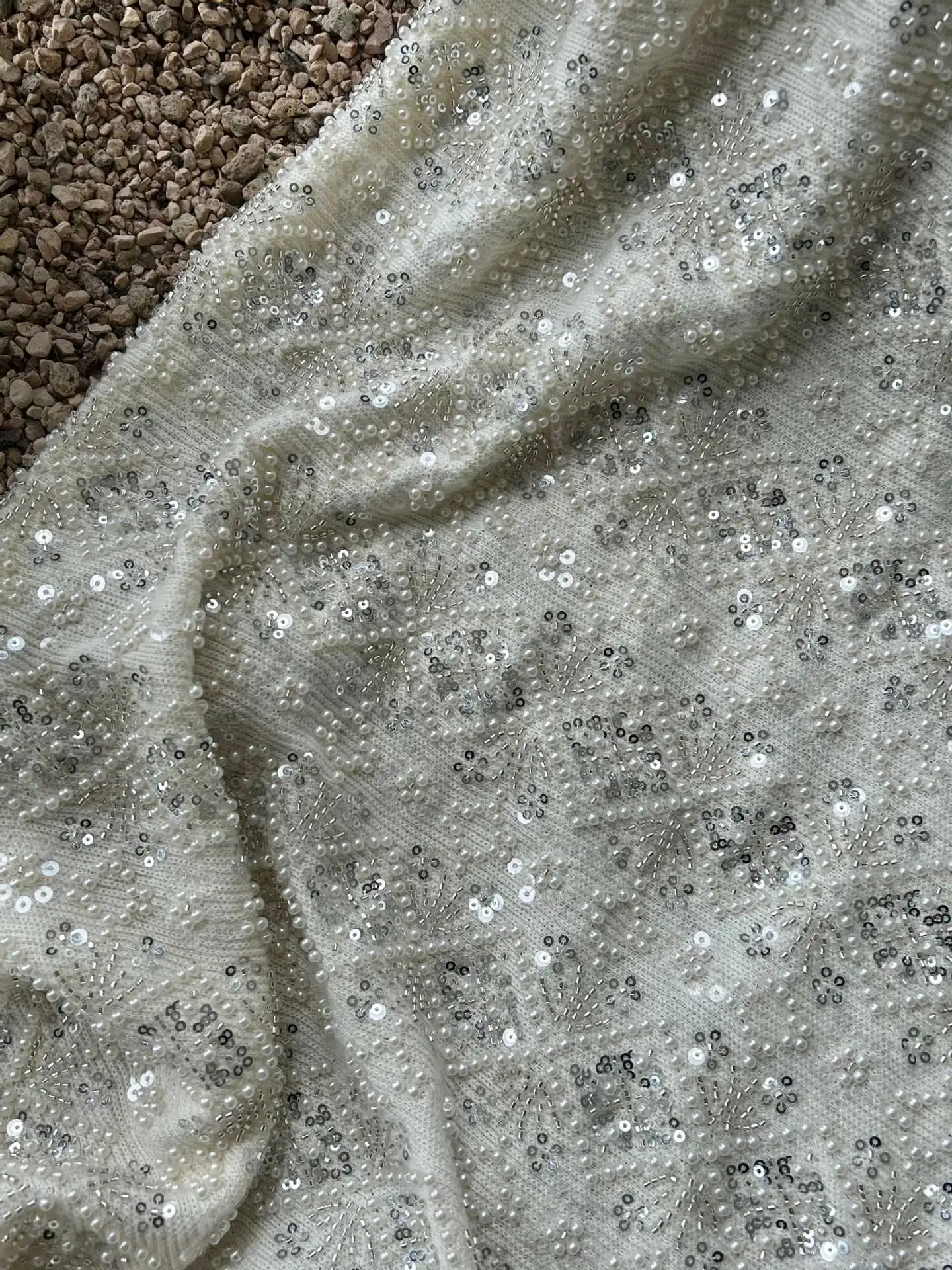 High-end heavy-duty pearl tube sequin embroidered knitted fabric for wedding dresses, dresses garment embroidery fabric
High-end heavy-duty pearl tube sequin embroidered knitted fabric for wedding dresses, dresses garment embroidery fabric