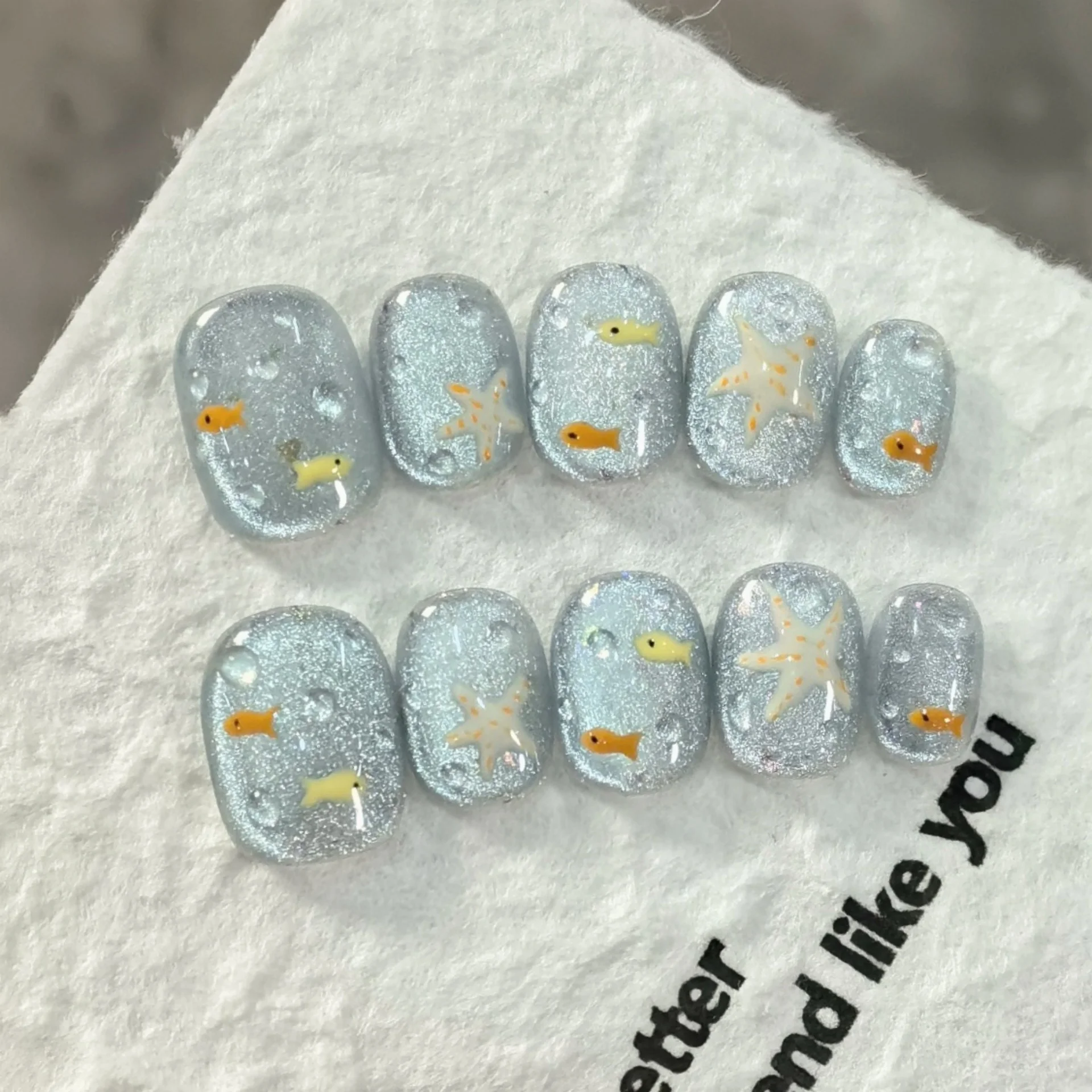 10pcs Blue Cat's Eye Handmade False Nail Art Cute Fish Pattern Short Square Round Fake Nail Tip Finished Wearable Press on Nails 
10pcs Blue Cat's Eye Handmade False Nail Art Cute Fish Pattern Short Square Round Fake Nail Tip Finished Wearable Press on Nails