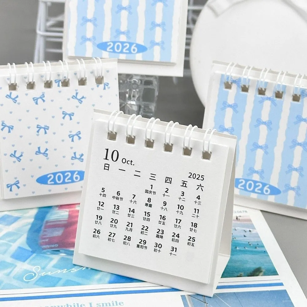 Креативный мини-настольный календарь на 2026 с бантом, мультяшный настольный календарь, портативный планировщик расписания на катушке, подарки
Креативный мини-настольный календарь на 2026 с бантом, мультяшный настольный календарь, портативный планировщик расписания на катушке, подарки