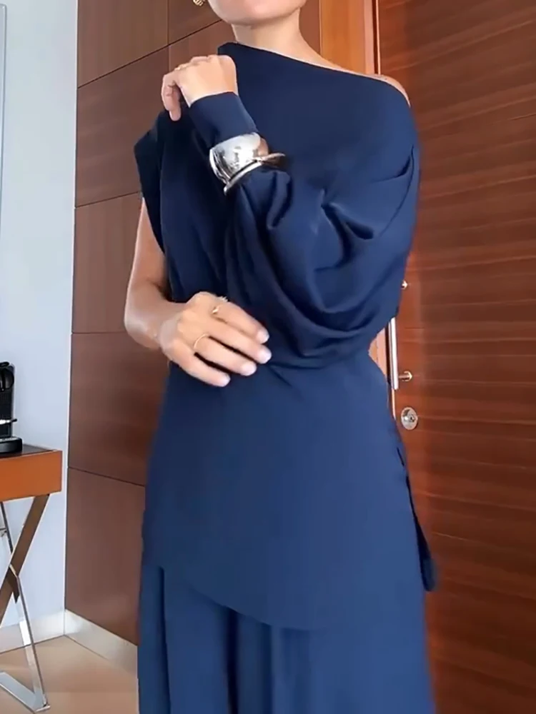 Топ с длинными рукавами и широкие брюки с диагональным воротником. Женский комплект. Новый осенний наряд с открытыми плечами. Простой однотонный повседневный костюм.
Топ с длинными рукавами и широкие брюки с диагональным воротником. Женский комплект. Новый осенний наряд с открытыми плечами. Простой однотонный повседневный костюм.