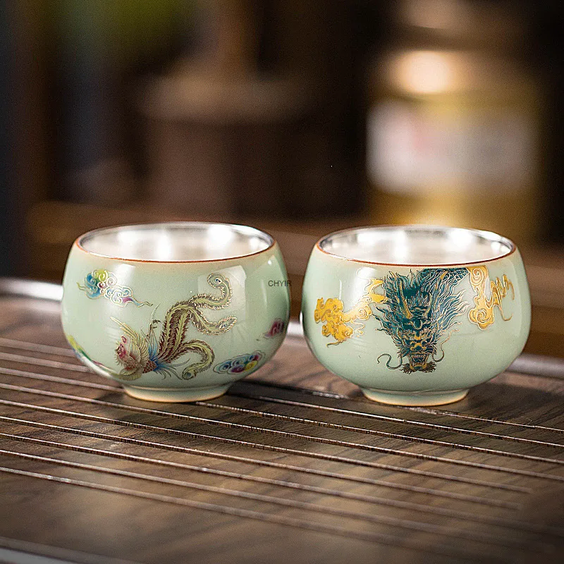 Позолоченная серебряная двойная чашка с драконом и фениксом, чашка для чая с изменением печи, одинарная чашка, керамическая чаша для чая, дегустационная чашка
Позолоченная серебряная двойная чашка с драконом и фениксом, чашка для чая с изменением печи, одинарная чашка, керамическая чаша для чая, дегустационная чашка