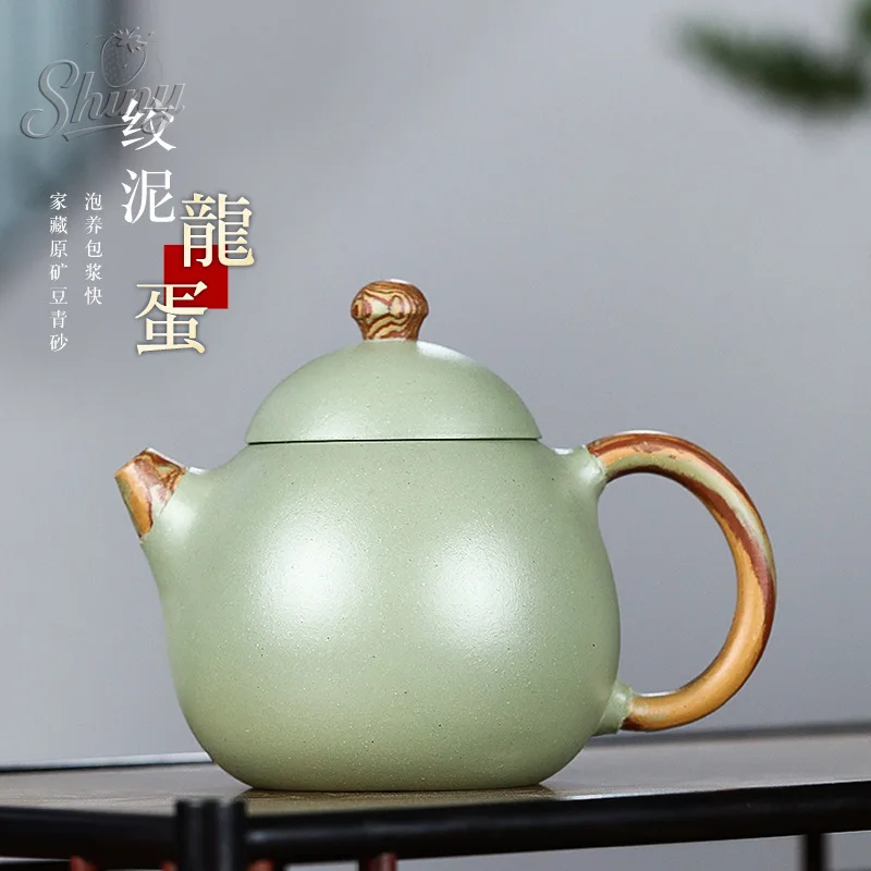 Оригинальный чайник Mine Bean, зеленый песок, фиолетовый песочный чайник, многожильный глиняный чайник с яйцом дракона, бытовой чайный сервиз кунг-фу
Оригинальный чайник Mine Bean, зеленый песок, фиолетовый песочный чайник, многожильный глиняный чайник с яйцом дракона, бытовой чайный сервиз кунг-фу