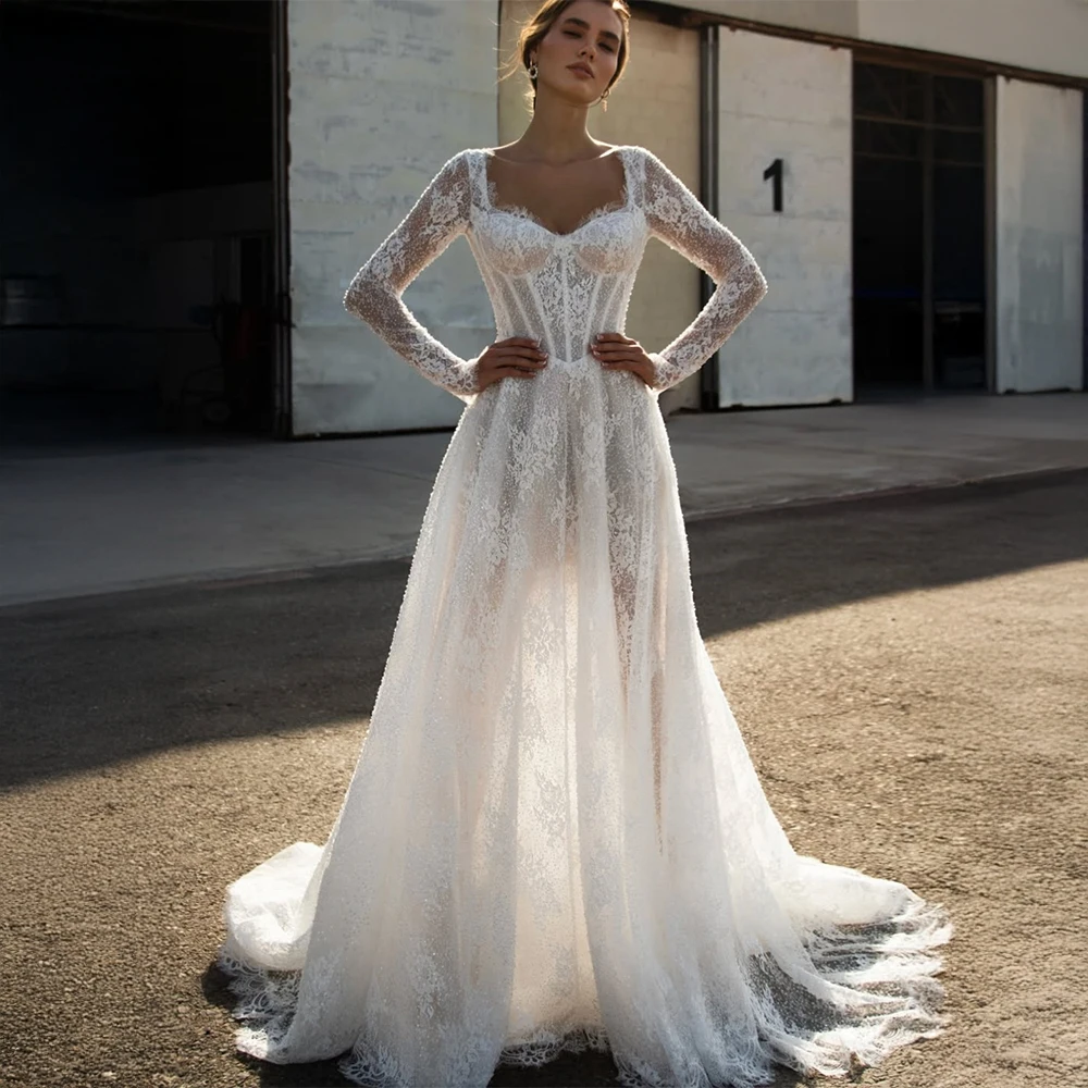 Индивидуальное свадебное платье с длинными рукавами из кружева, с корсетом на косточках, прозрачным кружевным дизайном и шлейфом-катедрал для невесты
Индивидуальное свадебное платье с длинными рукавами из кружева, с корсетом на косточках, прозрачным кружевным дизайном и шлейфом-катедрал для невесты