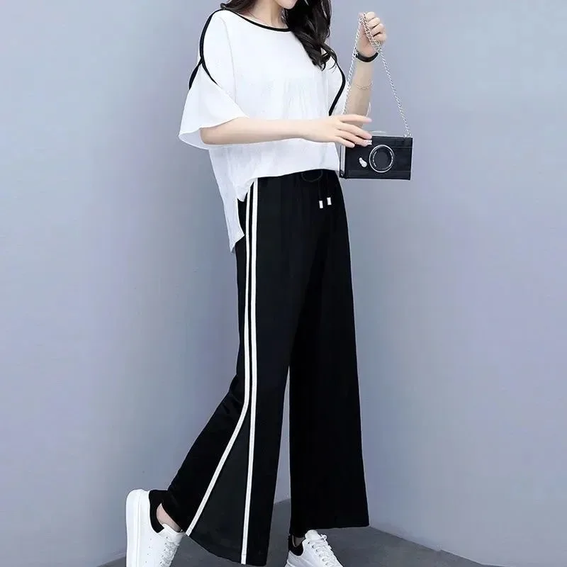 Женский летний новый шифоновый спортивный костюм 2025 года, модные широкие брюки в горошек, укороченный топ, комплект из двух предметов для женщин, одежда больших размеров 
Женский летний новый шифоновый спортивный костюм 2025 года, модные широкие брюки в горошек, укороченный топ, комплект из двух предметов для женщин, одежда больших размеров