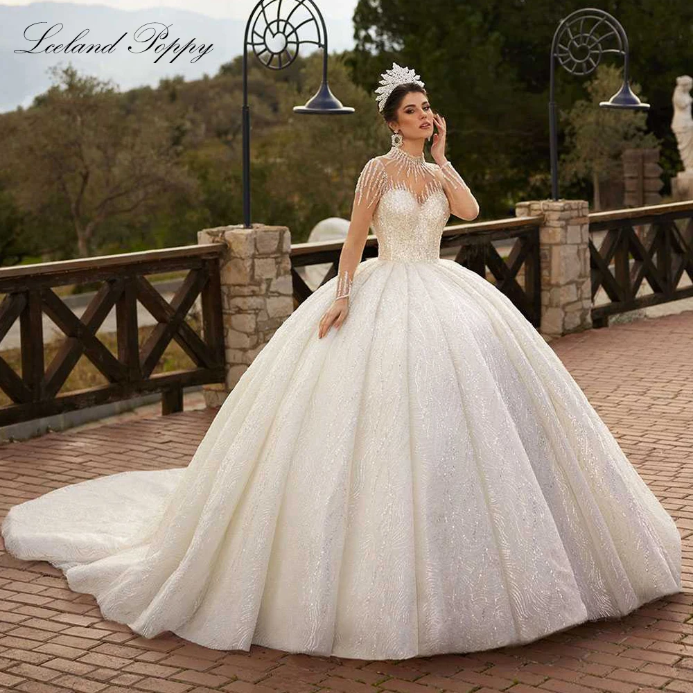 Lceland Poppy Customized High Neck Ball Gown Wedding Dresses Full Sleeves Beaded Lace Bridal Gowns with Chapel Train
Lceland Poppy Customized High Neck Ball Gown Wedding Dresses Full Sleeves Beaded Lace Bridal Gowns with Chapel Train