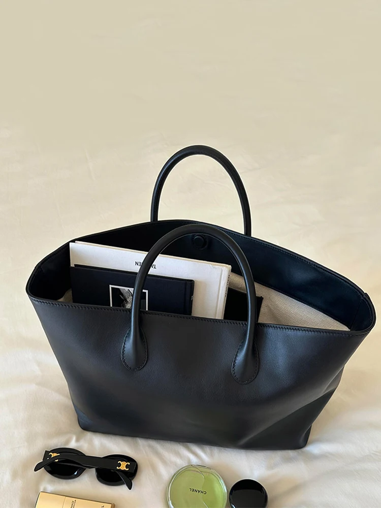 Bla Leather Large Capaci Tote Bag Women's 2025 New Luxury Small ence High-End Feeling Handbag Vegetable Basket Bag
Bla Leather Large Capaci Tote Bag Women's 2025 New Luxury Small ence High-End Feeling Handbag Vegetable Basket Bag