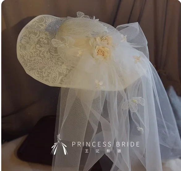 Princess's new French champagne flower white butterfly veil bridal hat big brim hat pastoral wedding flower hat accessories.
Princess's new French champagne flower white butterfly veil bridal hat big brim hat pastoral wedding flower hat accessories.