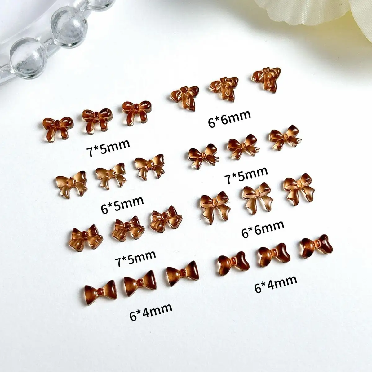 50PCS Maillard Style Atmosphere Resin Bow Nail Charms 3D Transparent Coffee Mini Bow Nail Art Decorations Accessories Supplies
50PCS Maillard Style Atmosphere Resin Bow Nail Charms 3D Transparent Coffee Mini Bow Nail Art Decorations Accessories Supplies