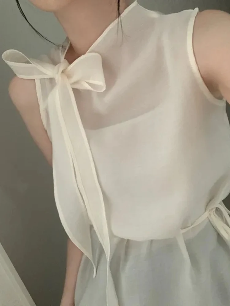 Elegant Summer French Style Blouse Women's Sleeveless Shirt with Sash Transparent Viscose Material Straight Cut Knot
Elegant Summer French Style Blouse Women's Sleeveless Shirt with Sash Transparent Viscose Material Straight Cut Knot